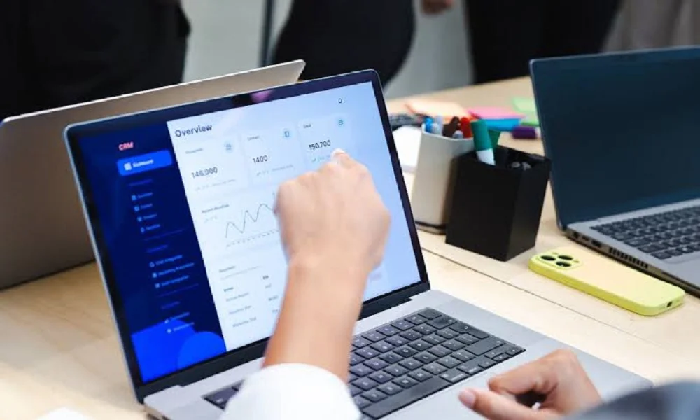 Person analyzing SEO dashboard analytics on a laptop screen